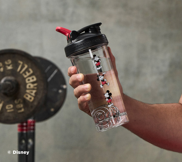 pro-series-n5 Mickey_Mouse_Protein_Shaker_Bottle_Being_Held_In_the_Gym.jpg